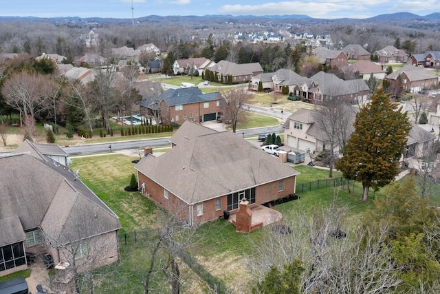 birds eye view of property with a residential view