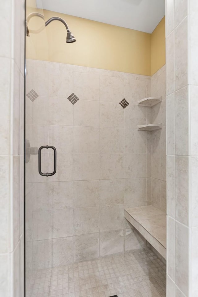 bathroom with a shower stall