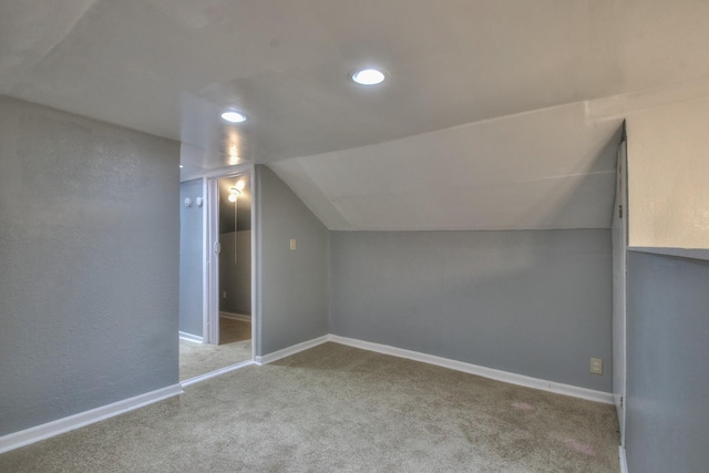 bonus room featuring carpet floors, lofted ceiling, baseboards, and recessed lighting