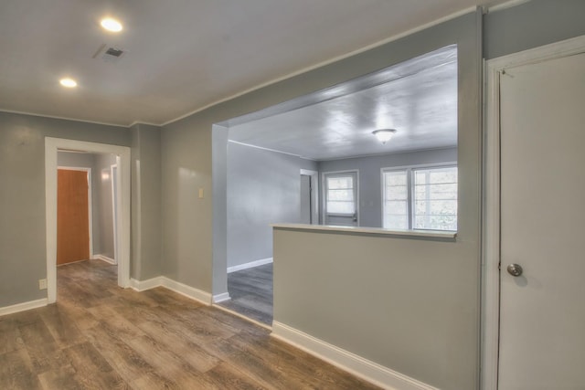 unfurnished room with dark wood-style floors, recessed lighting, visible vents, and baseboards