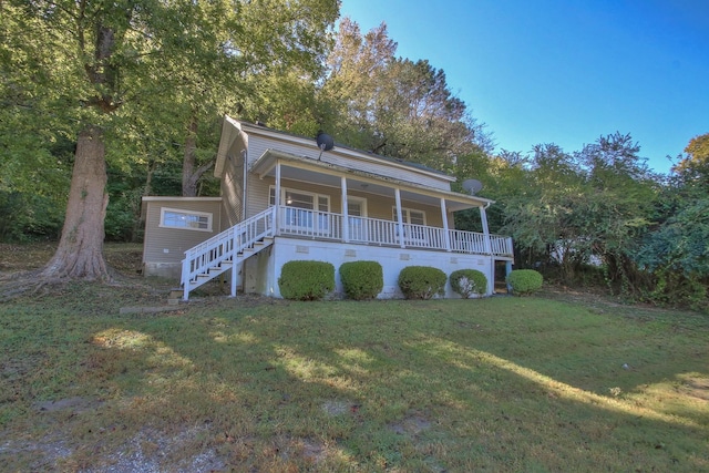 view of front of home with stairs, a front lawn, and a porch