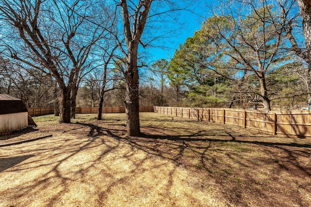 view of yard featuring an outbuilding and a fenced backyard