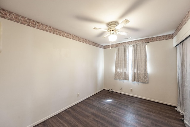 unfurnished bedroom featuring a ceiling fan, visible vents, dark wood finished floors, and baseboards