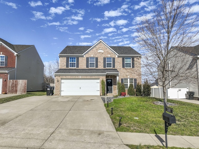 view of front of house with an attached garage, concrete driveway, brick siding, and a front yard