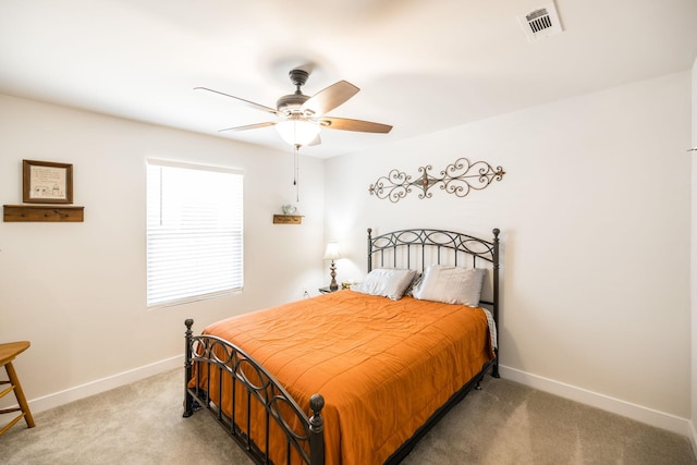 bedroom featuring carpet floors, visible vents, baseboards, and ceiling fan