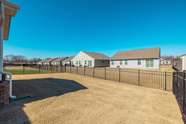 view of yard with fence and a residential view