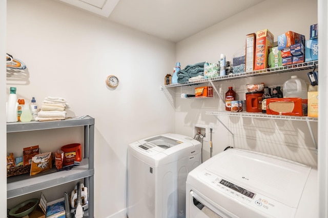 laundry area with laundry area and washer and clothes dryer