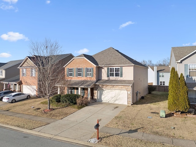 traditional-style home featuring concrete driveway, stone siding, a residential view, an attached garage, and fence