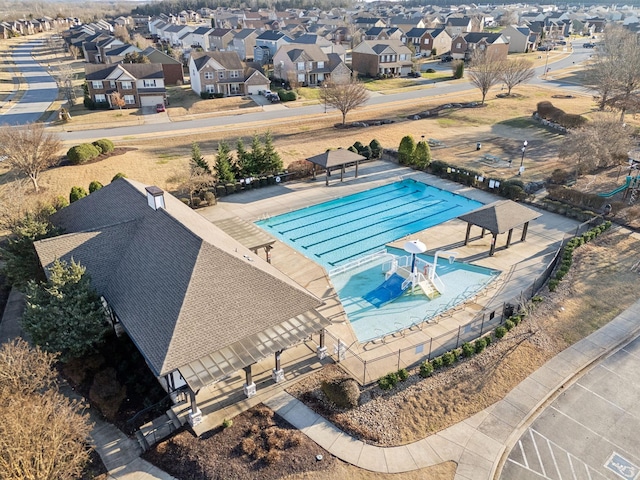 pool featuring a residential view, fence, and a patio