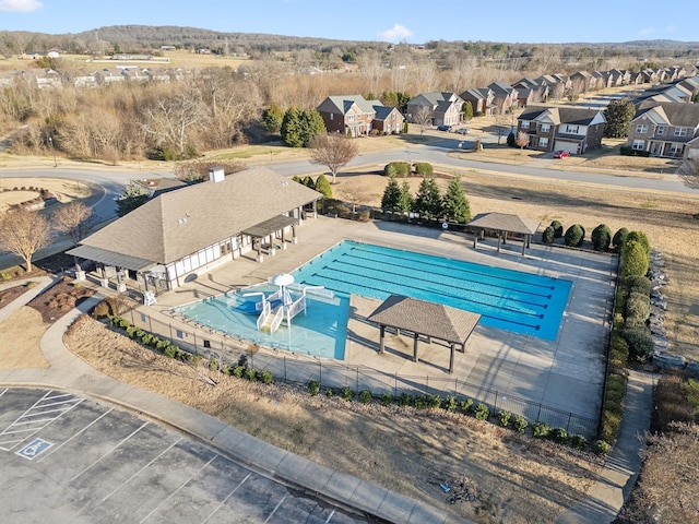 pool featuring a residential view, fence, a patio, and a gazebo