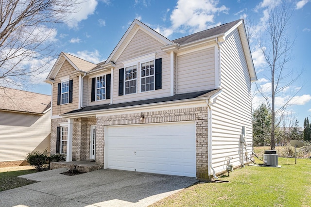 traditional-style house with driveway, brick siding, an attached garage, and a front yard