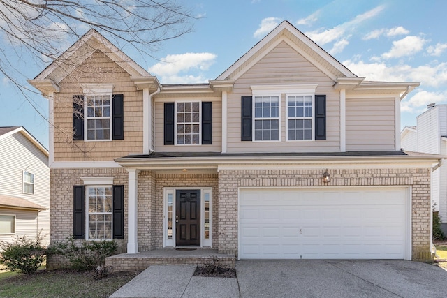 view of front of house featuring an attached garage and concrete driveway