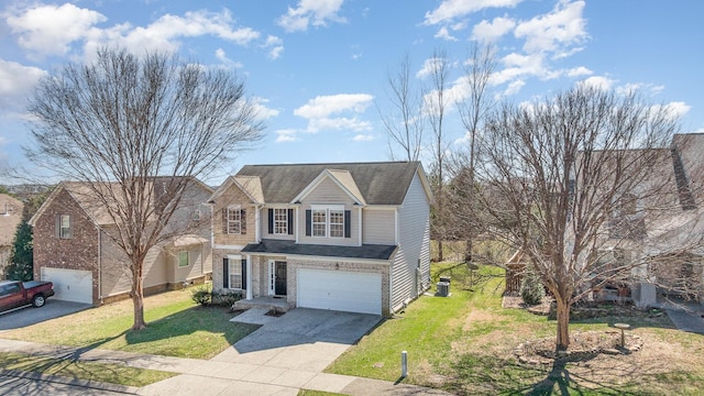 traditional home featuring a garage, driveway, a front lawn, and central AC unit