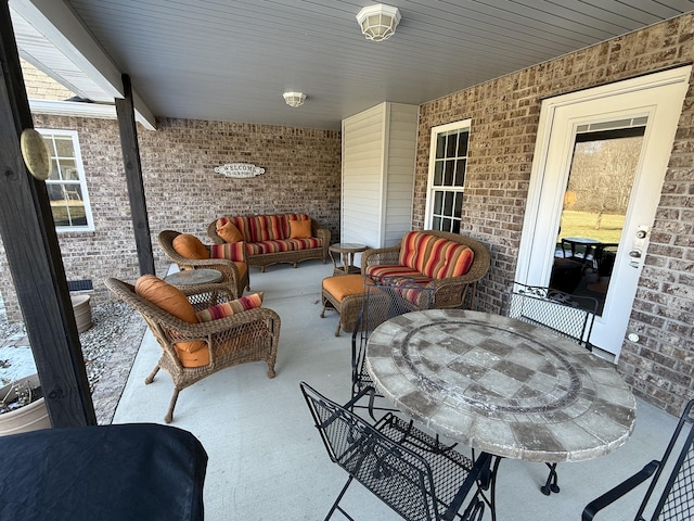 view of patio / terrace with outdoor dining area and an outdoor hangout area