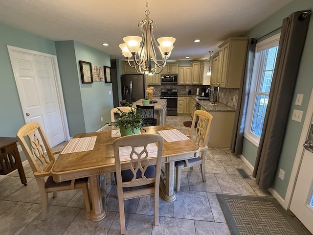 dining space with baseboards, recessed lighting, visible vents, and an inviting chandelier