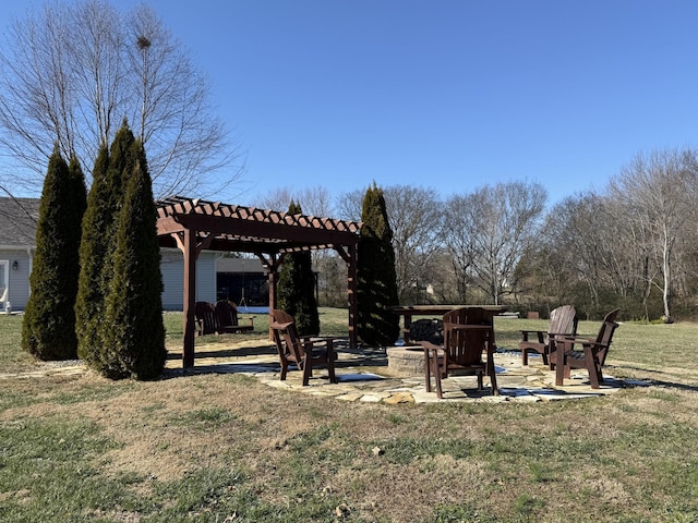 view of yard featuring an outdoor fire pit, a patio area, and a pergola