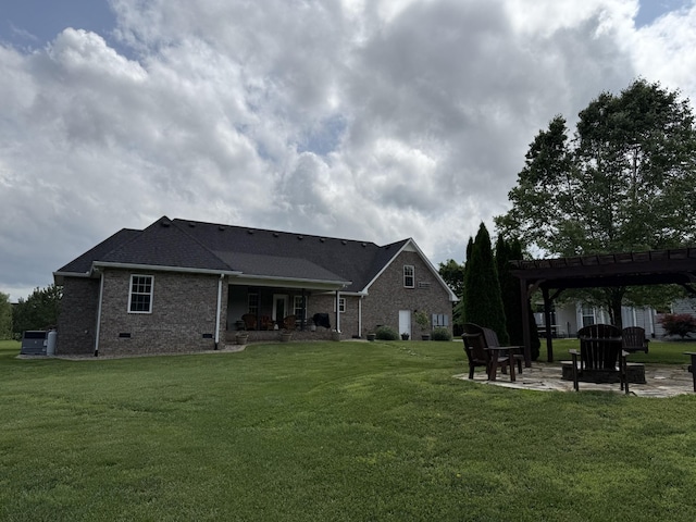 334 N Centerpoint Rd, Portland, TN 37148 - rear view of property featuring a pergola, a yard, a patio, and brick siding