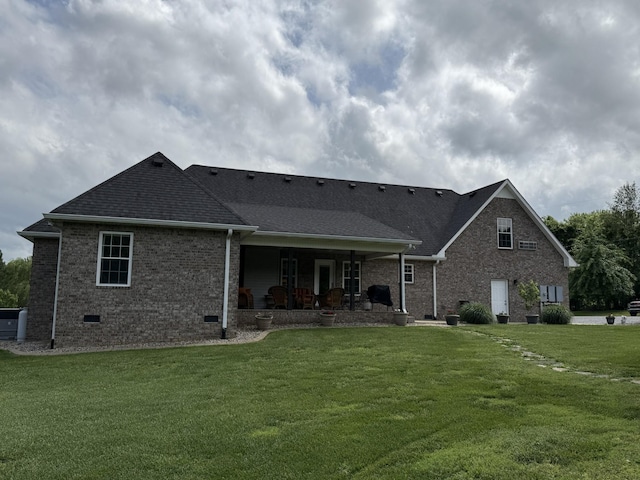 334 N Centerpoint Rd, Portland, TN 37148 - back of property with crawl space, brick siding, a lawn, roof with shingles, and covered porch