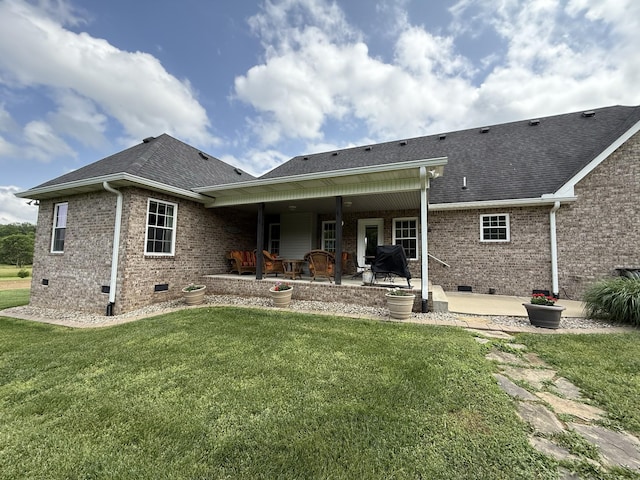 334 N Centerpoint Rd, Portland, TN 37148 - rear view of house with crawl space, brick siding, a patio area, and a yard
