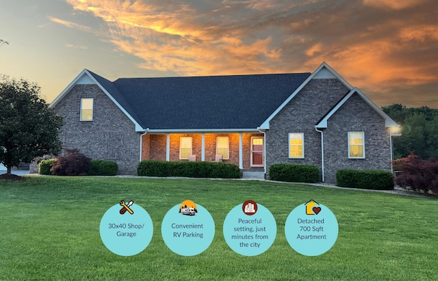 334 N Centerpoint Rd, Portland, TN 37148 - traditional-style home featuring a lawn, brick siding, and roof with shingles