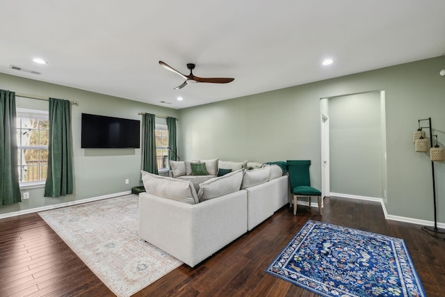 living room with ceiling fan, hardwood / wood-style floors, and baseboards