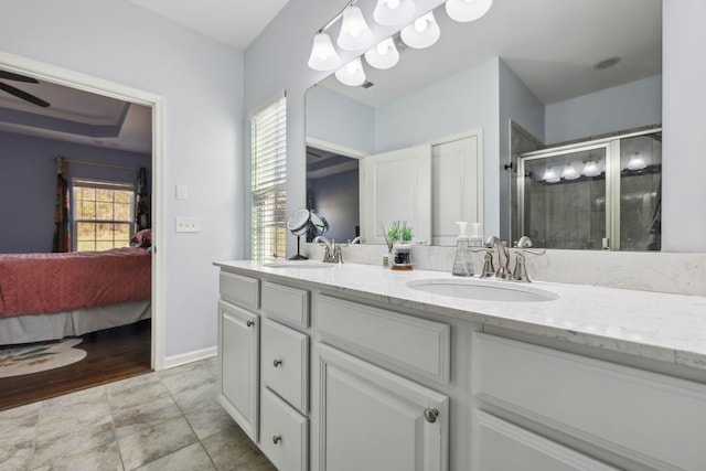 full bath with double vanity, ensuite bath, a sink, and a shower stall