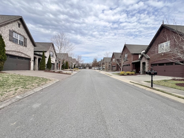 view of road with curbs and a residential view