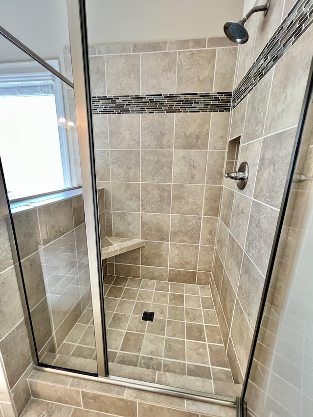 bathroom with a shower stall