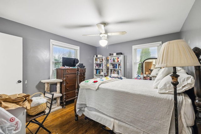 bedroom with wood finished floors and a ceiling fan