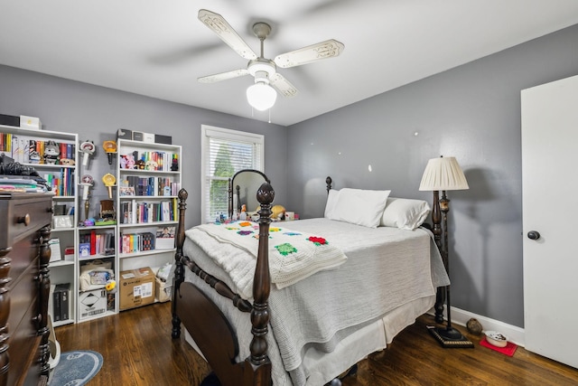 bedroom featuring a ceiling fan, baseboards, and wood finished floors