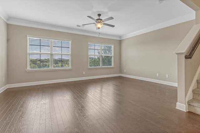 unfurnished room with stairs, visible vents, dark wood-style flooring, and ornamental molding