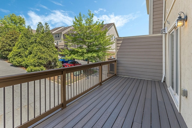 wooden deck with a residential view