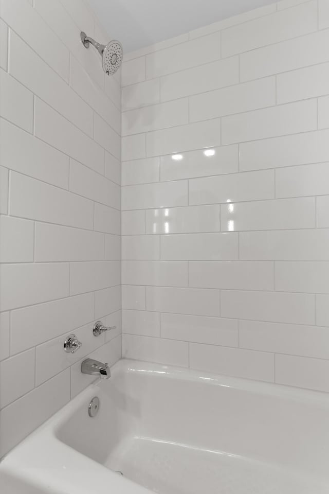 bathroom with shower / bathtub combination