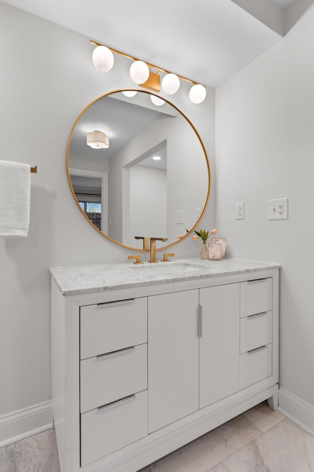 bathroom featuring vanity and baseboards