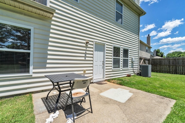 view of patio with fence and central air condition unit