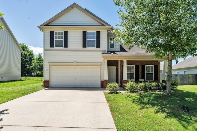 craftsman house featuring concrete driveway, brick siding, a front yard, and fence