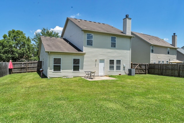 back of property with a patio area, a fenced backyard, central AC unit, and a yard