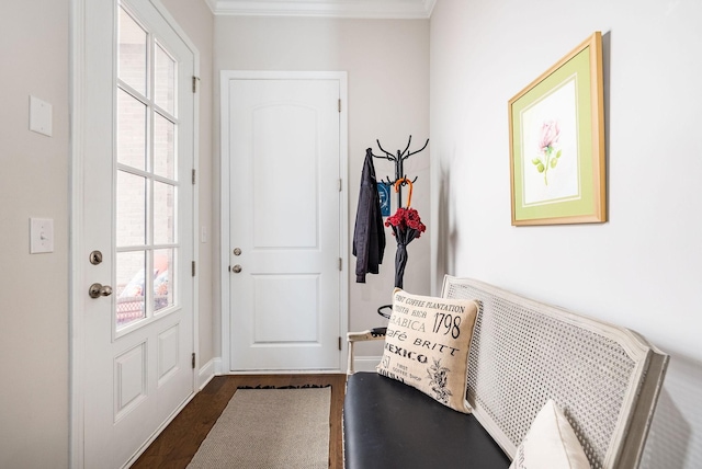 entryway with dark wood finished floors, a wealth of natural light, and crown molding