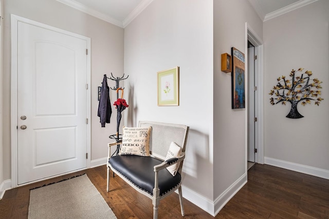 foyer entrance with baseboards, dark wood-type flooring, and crown molding