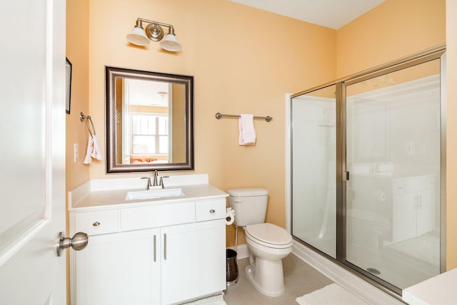 full bath with toilet, a shower stall, and vanity