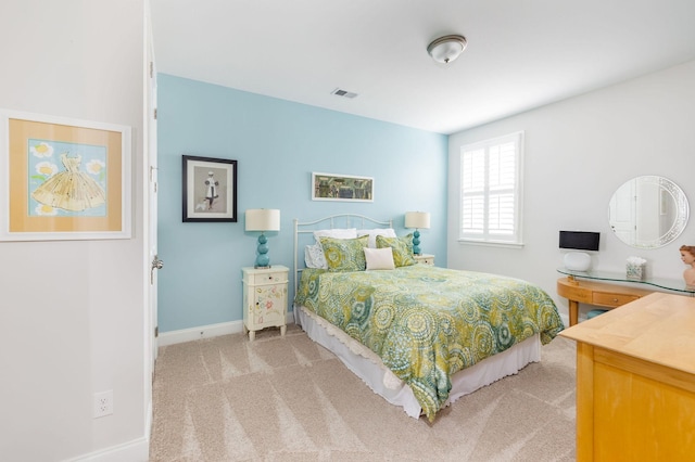 bedroom featuring carpet flooring, visible vents, and baseboards