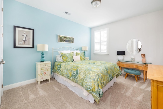 bedroom with carpet flooring, visible vents, and baseboards