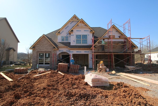 unfinished property featuring brick siding