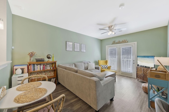 living area featuring ceiling fan and wood finished floors