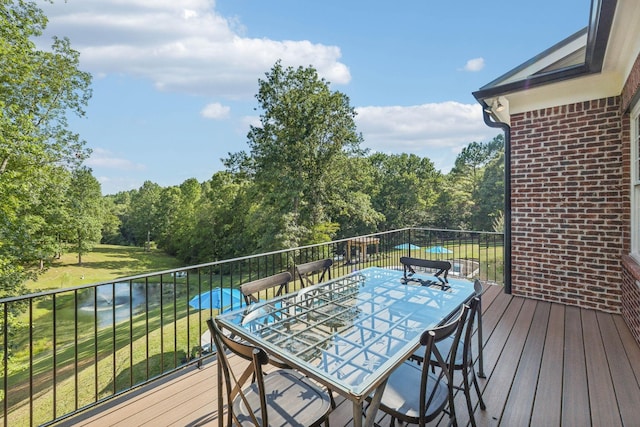 wooden deck featuring outdoor dining space