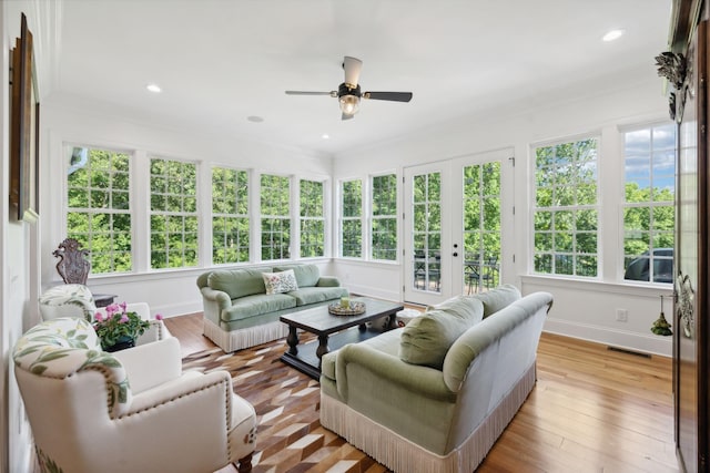 sunroom with french doors, visible vents, plenty of natural light, and ceiling fan