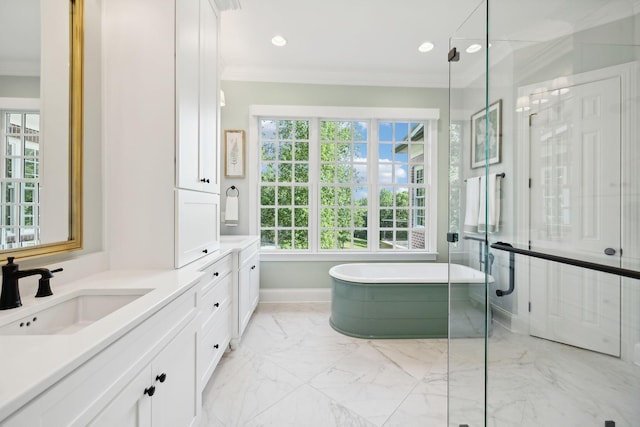 full bathroom featuring recessed lighting, vanity, marble finish floor, a soaking tub, and crown molding