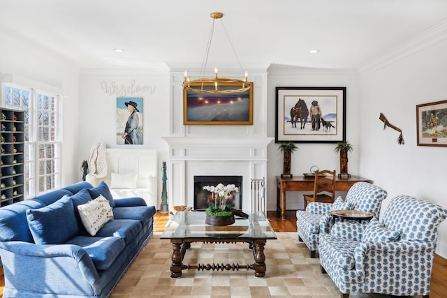 living room featuring a large fireplace, recessed lighting, a notable chandelier, and crown molding