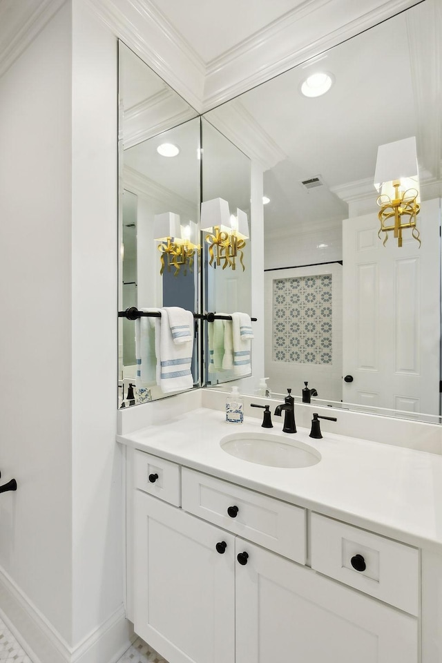 bathroom with baseboards, visible vents, a shower, crown molding, and vanity