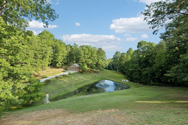 exterior space featuring a wooded view